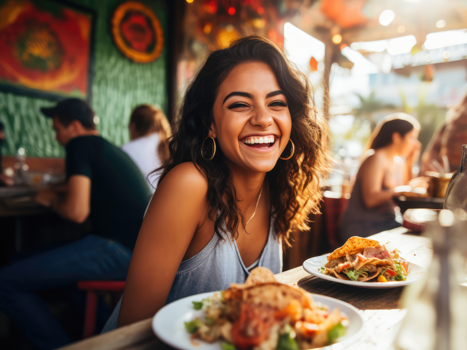 Young Mexican Woman Enjoying Tacos At Outdoor Mexica Restaurant